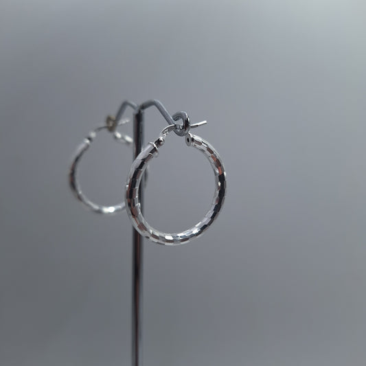 Silver disco hoop earings. Made in nz.