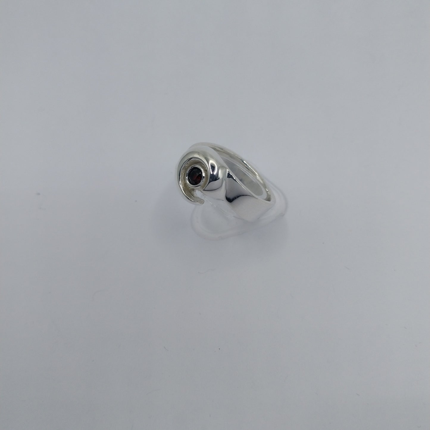 Side profile of viking silver ring set with garnet