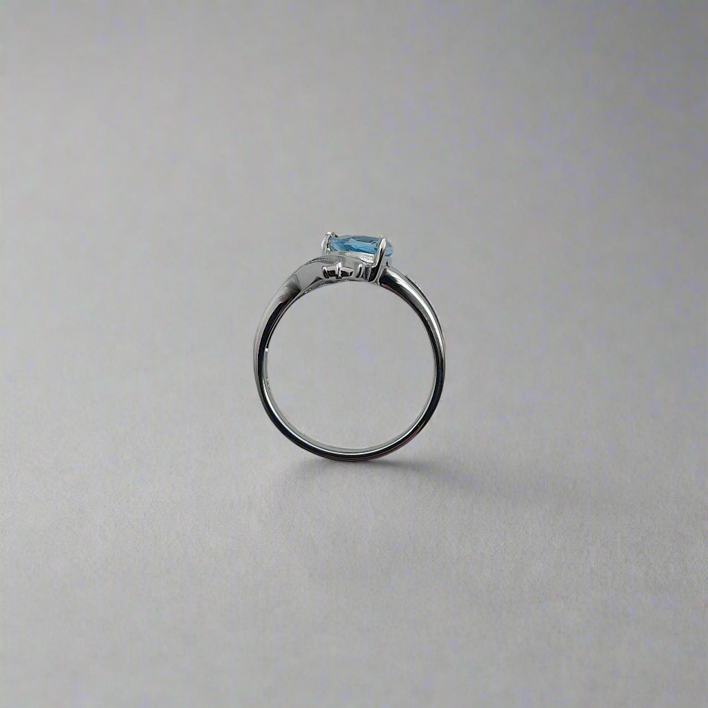 Art deco inspired silver blue topaz ring