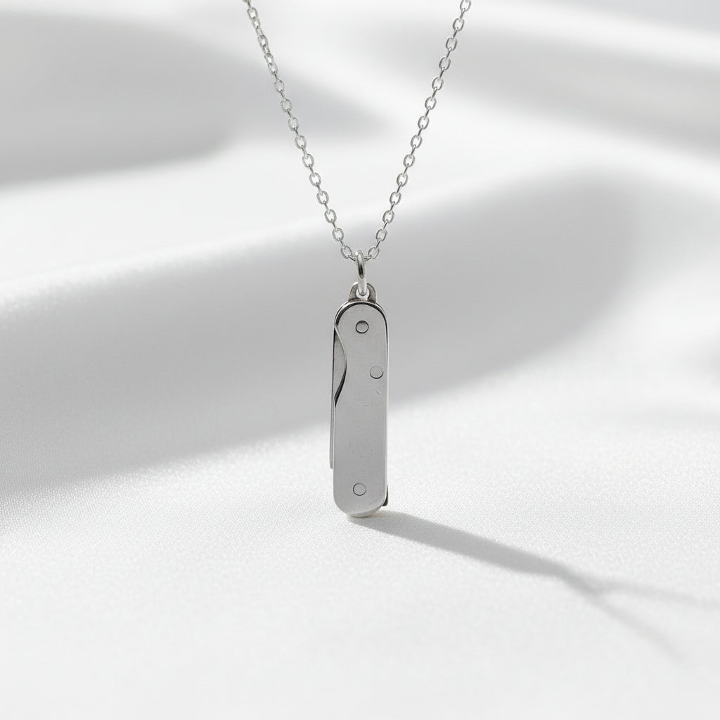Silver necklace with a pendant on a white background