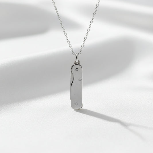 Silver necklace with a pendant on a white background
